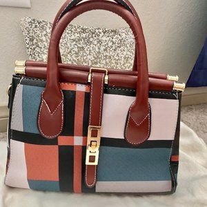 Color Block Medium Handbag with Shoulder Strap Included.
